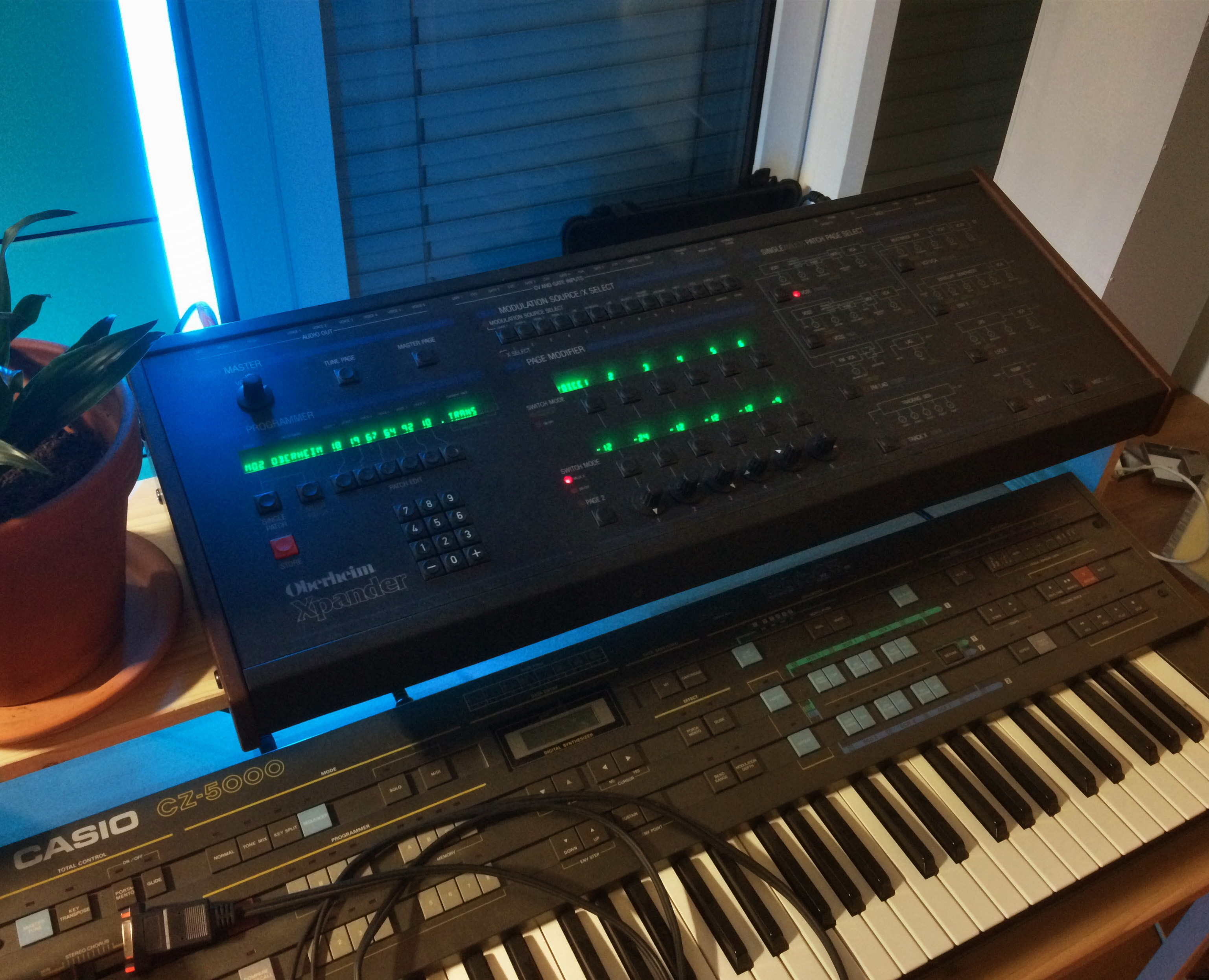 Image of an Oberheim Xpander synthesizer and a Casio CZ-5000